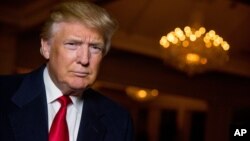 Republican presidential candidate Donald Trump poses for a portrait after an interview with The Associated Press in Sterling, Va., Dec. 2, 2015. 