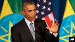 U.S. President Barack Obama gestures during a joint press conference with Ethiopian Prime Minister Hailemariam Desalegn at the National Palace in Addis Ababa, July 27, 2015.