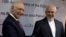 Iranian Foreign Minister Mohammad Javad Zarif, right, shakes hands with former Pakistan's adviser on foreign affairs Sartaj Aziz in Islamabad, Pakistan, March 12, 2018.