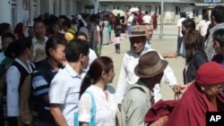 Tibetans in Nepal wait in line to cast their ballots in the preliminary election of Kalon Tripa-prime minister and Tibetan Parliament-in-Exile on Sunday.