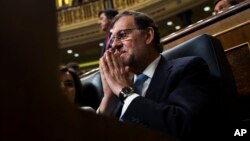 FILE - Spain's acting Prime Minister Mariano Rajoy attends the Spanish parliament in Madrid, July 19, 2016.