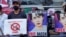 Myanmar, Yangon, Demonstrators hold signs during a protest against the military coup