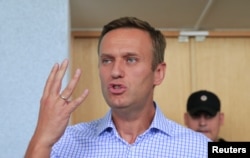 Russian opposition leader Alexei Navalny, who is charged with participation in an unauthorised protest rally, attends a court hearing in Moscow, July 1, 2019.
