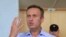 FILE - Russian opposition leader Alexei Navalny, who is charged with participation in an unauthorized protest rally, attends a court hearing in Moscow, July 1, 2019. 