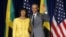 U.S. President Barack Obama stands for a photograph with Jamaica's Prime Minister Portia Simpson Miller upon his arrival at Jamaica House in Kingston, April 9, 2015. 