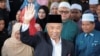 Former Malaysian leader charged with sedition, accused of mocking former king 