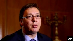 FILE - Serbian Prime Minister Aleksandar Vucic speaks with The Associated Press during his visit to Tirana, Albania, May 27, 2015. 