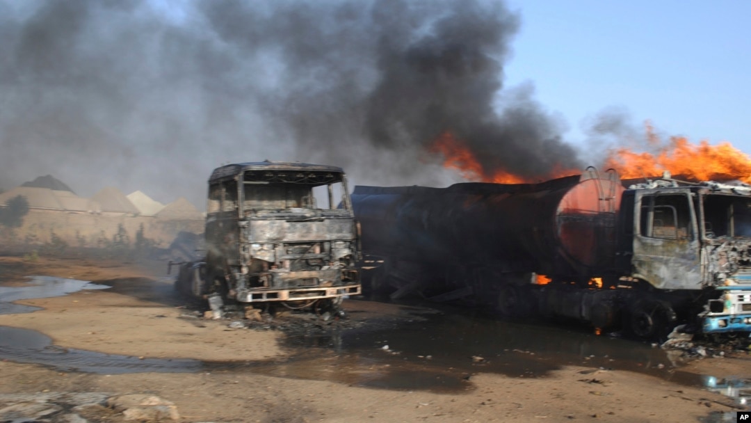 Burnout petrol tankers following a suicide attack in Maiduguri, Nigeria, March 3, 2017. Three suicide bombers set ablaze three fuel tankers in the center of Nigeria's northeastern city of Maiduguri before dawn, officials said,