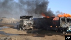 Burnout petrol tankers following a suicide attack in Maiduguri, Nigeria, March 3, 2017. Three suicide bombers set ablaze three fuel tankers in the center of Nigeria's northeastern city of Maiduguri before dawn, officials said,