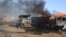 Burnout petrol tankers following a suicide attack in Maiduguri, Nigeria, March 3, 2017. Three suicide bombers set ablaze three fuel tankers in the center of Nigeria's northeastern city of Maiduguri before dawn, officials said,