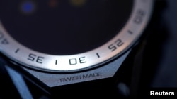 FILE - A "Swiss-made" is pictured on the new Tag Heuer Connected Modular 45 model watch after its presentation in Brunnen, Switzerland, March 14, 2017.