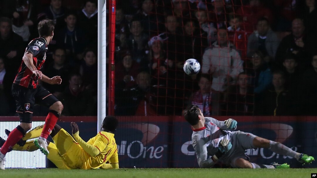 Bournemouth’s Dan Gosling scores a goal during the English League Cup soccer quarterfinal match between AFC Bournemouth and Liverpool at Goldsands Stadium, Bournemouth, England, Wednesday, Dec. 17, 2014. (AP Photo/Tim Ireland)