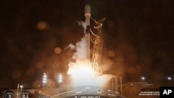 In this image from video provided by SpaceX, the company's SpaceX’s Falcon rocket, carrying NASA's newest space telescope, Spherex, lifts off from Vandenberg Space Force Base, Calif., March 11, 2025. 