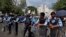 FILE - Pakistani police officers with riot gear. 