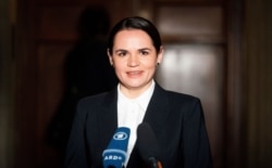 FILE - Sviatlana Tsikhanouskaya, leader of the opposition from Belarus, speaks to reporters after meeting with political party officials in Berlin, Oct. 6, 2020.