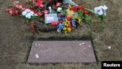 FILE - The replacement grave marker of Lee Harvey Oswald is pictured at Rose Hill Cemetery in Fort Worth, Texas.