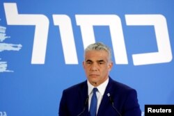 FILE - Yair Lapid, head of Yesh Atid, holds a news conference in Tel Aviv, Israel, Feb. 21, 2019.