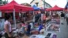 Handicraft and souvenir vendors wait for customers and tourists at the night market of Luang Prabang, October 18, 2009.