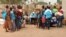 FILE — South Sudanese children line up to receive school materials and other supplies in Yambio, on February 12, 2019.