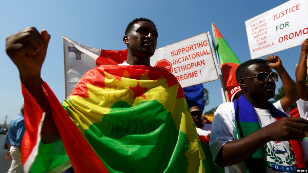 FILE - Ethiopian migrants, all members of the Oromo community of Ethiopia living in Malta, protest against the Ethiopian regime.