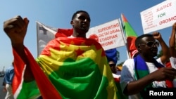 FILE - Ethiopian migrants, all members of the Oromo community of Ethiopia living in Malta, protest against the Ethiopian regime.