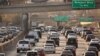 FILE - Traffic moves along the Hollywood Freeway in Los Angeles, California, Dec. 12, 2018.