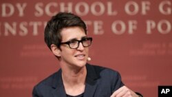 FILE - In this Oct. 16, 2017 file photo, MSNBC television anchor Rachel Maddow moderates a panel on the campus of Harvard University, in Cambridge, Mass.