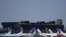 FILE - Commercial aircrafts remain at the tarmac of Jorge Newbery airport, which is closed during the outbreak of the new coronavirus, COVID-19, in Buenos Aires, Argentina, March 20, 2020. 