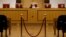 FILE - The head of Poland's Constitutional Court Andrzej Rzeplinski (C) and judges attend a session at the Constitutional Tribunal in Warsaw, Poland, April 6, 2016. 