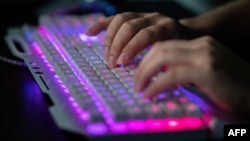 FILE - A member of a group of hackers uses his computer at the group's office in Dongguan, China, Aug. 4, 2020. Hackers linked to the Chinese government have broken into parts of the U.S. telecommunications system, officials said Oct. 25, 2024.