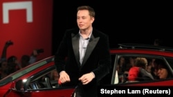 Tesla Motors CEO Elon Musk alights from a Model S