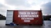 FILE - A shipping container stands in position during a demonstration by the press freedoms organization Reports Sans Frontier (Reporters Without Borders) in Paris, Dec. 16, 2014. Reports from inside Eritrea describe inhumane conditions where prisoners are held in shipping crates in the desert.