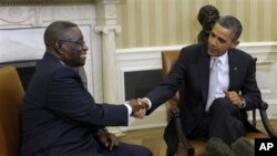 Ghana's President John Evans Atta Mills (left) with President Obama at the White House. They met to discuss the growing commercial and economic ties between the two nations, Mar 8, 2012.