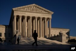 The Supreme Court is seen at sundown on the eve of Election Day, in Washington, Monday, Nov. 2, 2020.