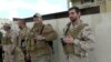 U.S. military veterans stand next to Christian militia members in Ninewah, Iraq, March 30, 2016. (S. Behn / VOA) 