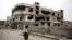 FILE - A devastated part of Homs, Syria.