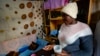 FILE - Idah Musimbi, 16, who contracted HIV at birth, takes PEPFAR-supplied anti-retroviral pills, in Nairobi, Kenya, Aug. 16, 2023. An emergency order could shield the world's largest HIV program from the 90-day funding freeze of foreign development aid.