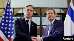 FILE - U.S. Secretary of State Antony Blinken meets Israel's President Isaac Herzog, during his week-long trip aimed at calming tensions across the Middle East, at David Kempinski Hotel, in Tel Aviv, Israel, January 9, 2024.