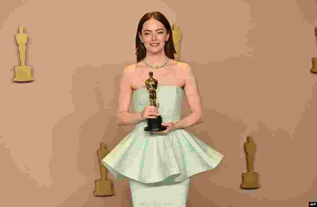 U.S. actress Emma Stone poses in the press room with the Oscar for Best Actress in a Leading Role for &quot;Poor Things&quot; during the 96th Annual Academy Awards at the Dolby Theatre in Hollywood, California, on March 10, 2024.
