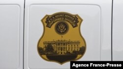 FILE - The seal of the U.S. Secret Service Uniformed Division is seen on the side of a vehicle in Washington, D.C., Oct. 2, 2014.