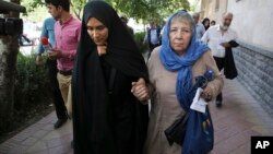 Mary Rezaian, mother of detained Washington Post correspondent Jason Rezaian, right, and Jason's wife Yeganeh leave court in Tehran, Iran, Aug. 10, 2015. Rezaian was one of four American detainees freed by Iran on Jan. 16, 2016.