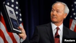 Former Rep. Asa Hutchinson (R-AR), a consultant of the National Rifle Association, shows and discusses the findings and recommendations of the National School Shield Program at the National Press Club in Washington Apr. 2, 2013.