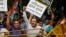 Delhi Pradesh Youth Congress activists shout slogans behind police barricade outside Pakistan embassy, New Delhi, Aug. 7, 2013.