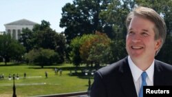 With the U.S. Supreme Court building in the background, Supreme Court nominee judge Brett Kavanaugh arrives to meet with Senate Majority Leader Mitch McConnell on Capitol Hill in Washington, July 10, 2018. 