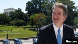 With the U.S. Supreme Court building in the background, Supreme Court nominee judge Brett Kavanaugh arrives prior to meeting with Senate Majority Leader Mitch McConnell on Capitol Hill in Washington, July 10, 2018. 