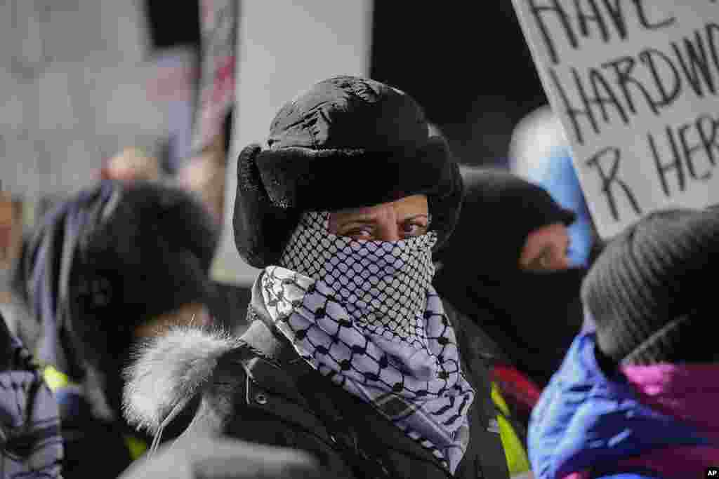 Anti-Trump protesters march to Trump Tower as they rally for a number of issues, including immigrant rights, the Israel-Hamas war, women's reproductive rights and racial equality, in Chicago, Jan. 20, 2025.