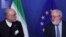 Iran's Vice President and Head of the Atomic Energy Organisation Ali Akbar Salehi, left, looks at European Union Climate Action and Energy Commissioner Miguel Arias Canete during a joint news conference in Brussels, Nov. 26, 2018. 