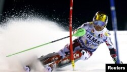 Marcel Hirscher of Austria clears a gate during the first run in the men's slalom at the Alpine Skiing World Cup in Madonna di Campiglio, northern Italy, December 22, 2015. In his second run, a drone crashed directly behind him.