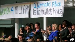 Women attending a Women for Hillary event react as Democratic presidential candidate Hillary Clinton speaks at at the New York Hilton hotel in midtown Manhattan one day ahead of the New York primary, April 18, 2016. 