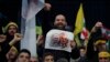 Supporters of Hezbollah leader Sayyed Hassan Nasrallah chant slogans in a southern suburb of Beirut, Lebanon, Jan. 5, 2020, following the U.S. airstrike in Iraq that killed Iranian Revolutionary Guard Gen. Qassem Soleimani. 